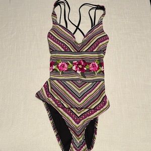 NEW. One piece. Size small